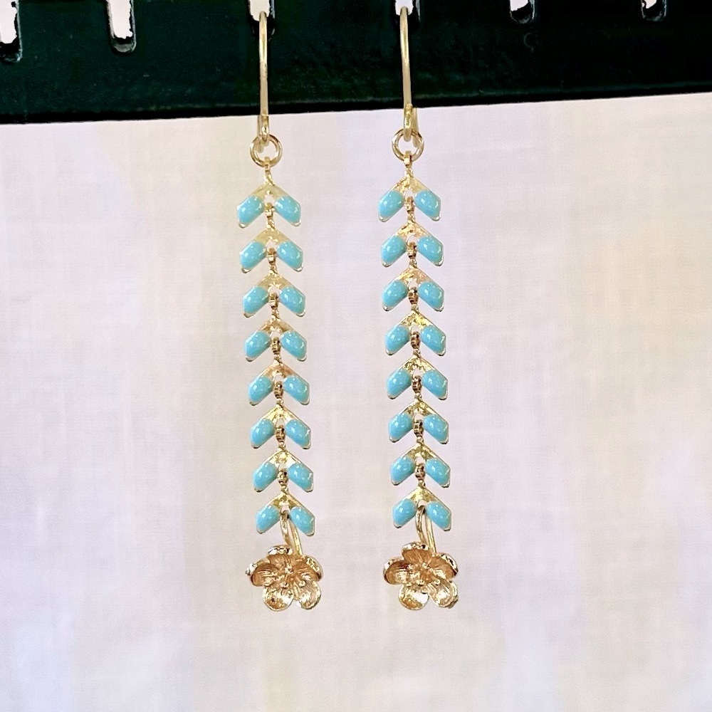 Handmade fishbone type drop earring. Gold + light blue enamel + tiny gold flower